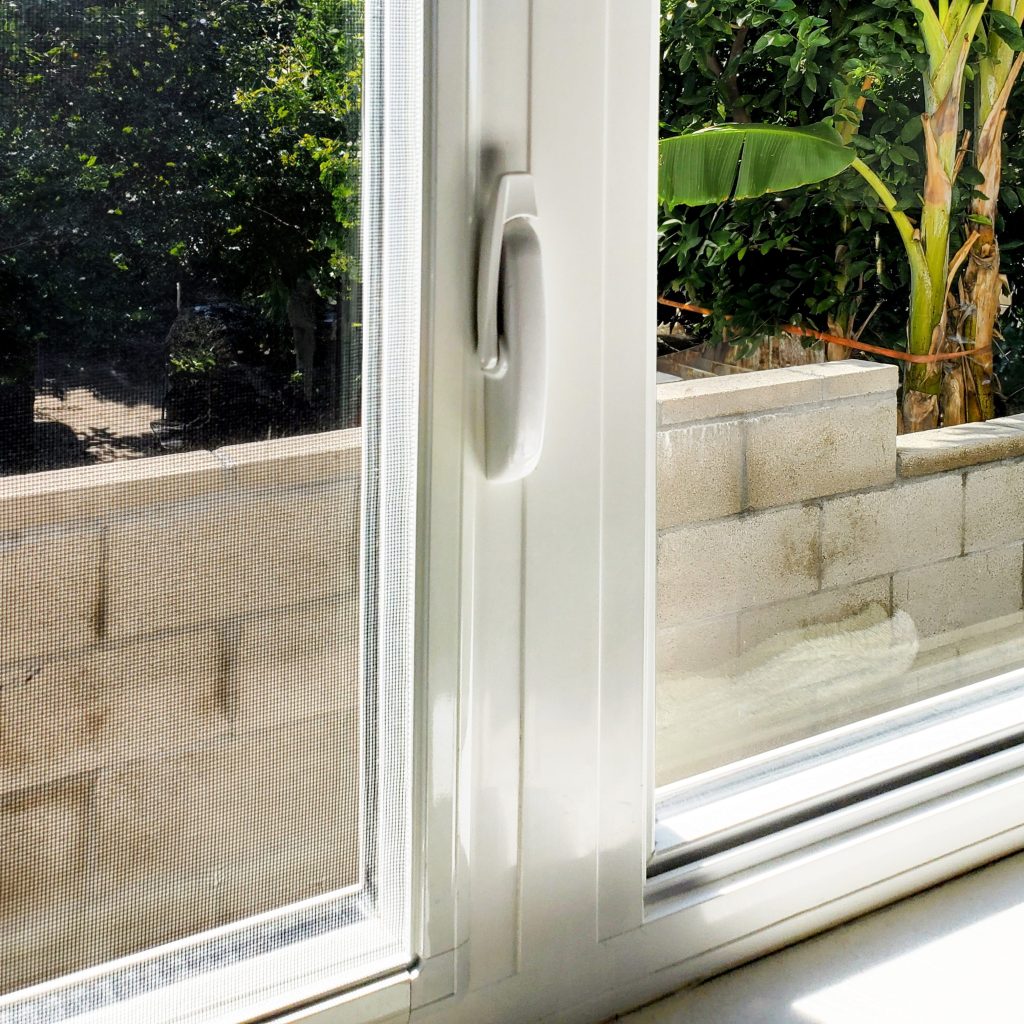 A close-up shot of a white GA series window with a handle.