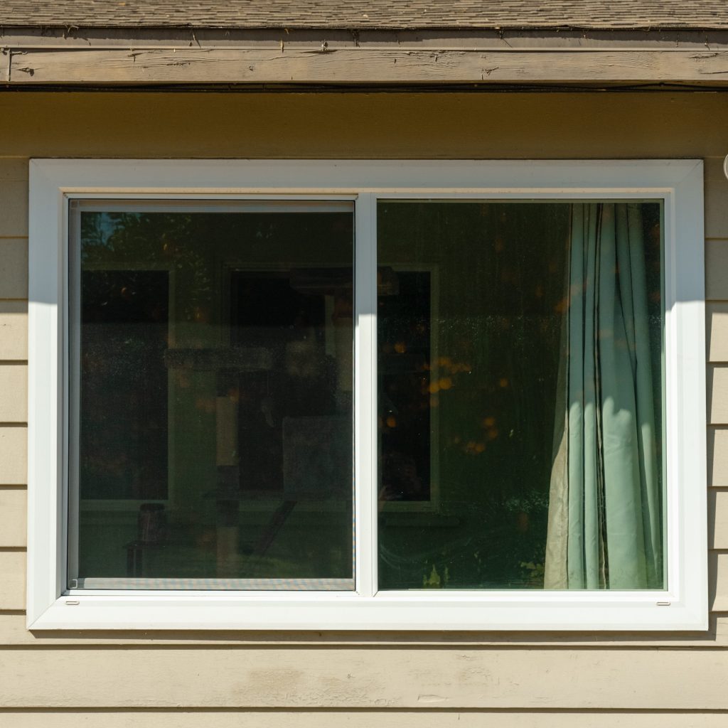 Angled front view with bag zipped and handles upright.